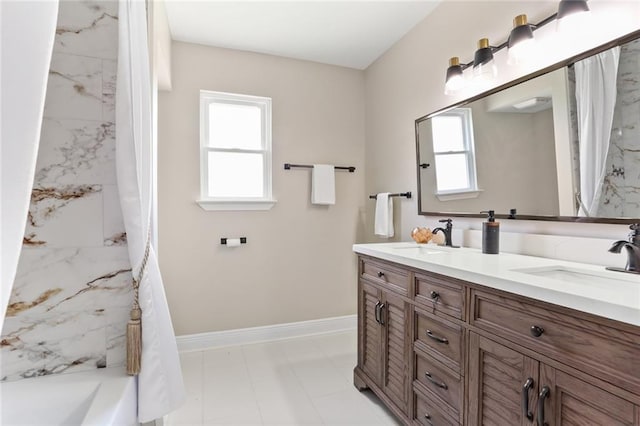 bathroom featuring a shower with curtain, vanity, and a wealth of natural light