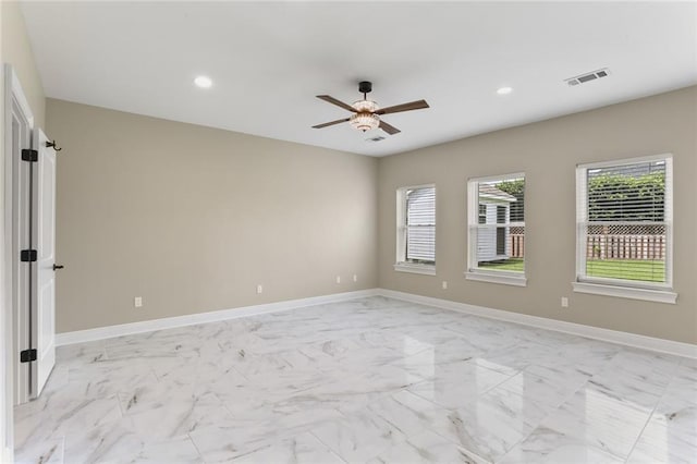 spare room featuring ceiling fan