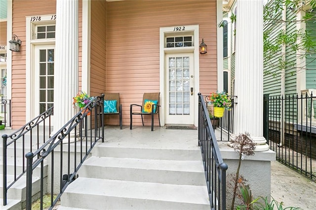 property entrance with covered porch