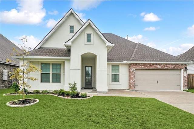 view of front of house with a front yard and a garage