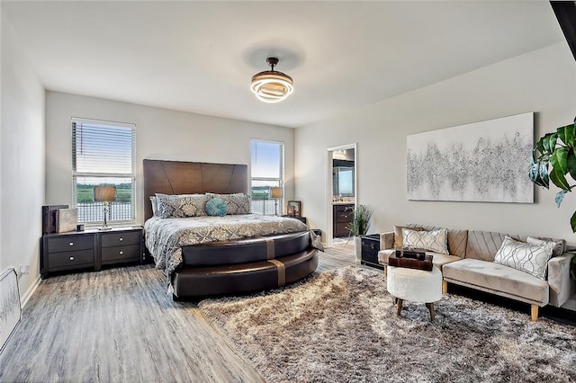 bedroom with hardwood / wood-style floors