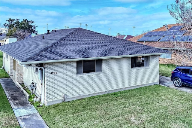 view of property exterior with a yard