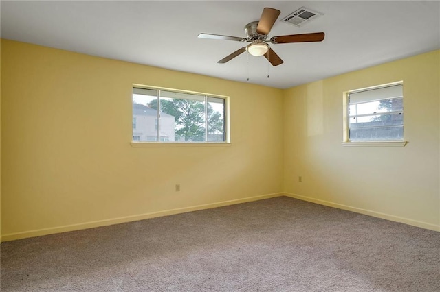 empty room with carpet and ceiling fan