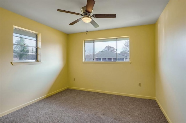 carpeted empty room with ceiling fan