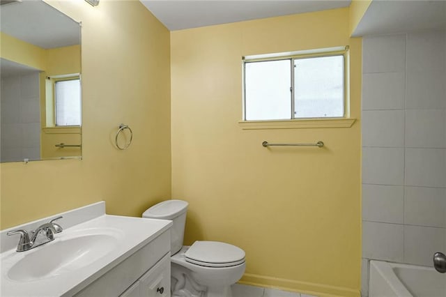 bathroom featuring tile patterned flooring, vanity, and toilet