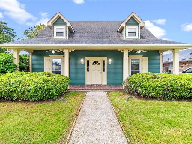 view of front of house featuring a front yard and a porch