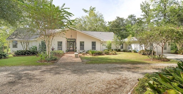 single story home featuring a front yard