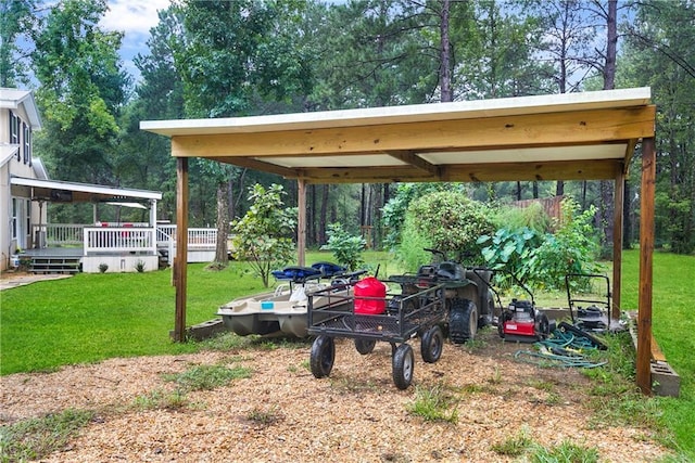 view of yard with dirt driveway and a wooden deck