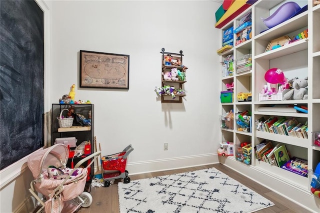 recreation room featuring hardwood / wood-style floors