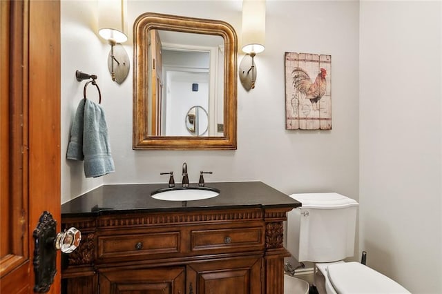 bathroom with vanity and toilet