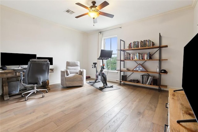 office area featuring ceiling fan, light hardwood / wood-style floors, and ornamental molding