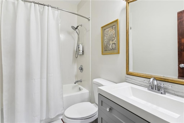 full bathroom with vanity, shower / bath combo with shower curtain, and toilet