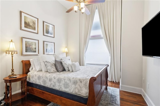 bedroom featuring ceiling fan and dark hardwood / wood-style floors