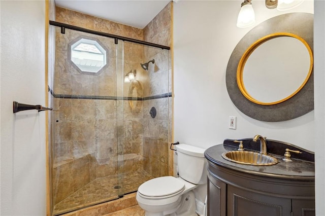 bathroom with vanity, toilet, and walk in shower