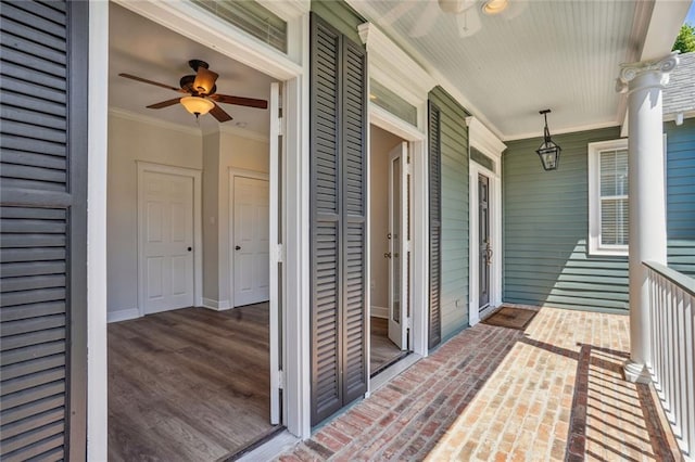 balcony with a porch and ceiling fan