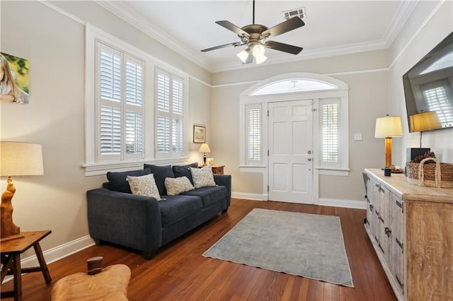 living room featuring crown molding, dark hardwood / wood-style flooring, and plenty of natural light