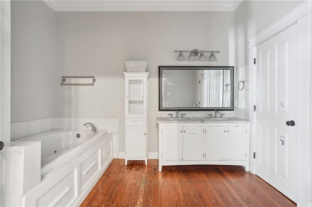 bathroom featuring a bath, wood-type flooring, vanity, and crown molding