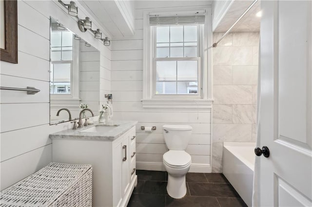 bathroom with tile patterned flooring, vanity, and toilet