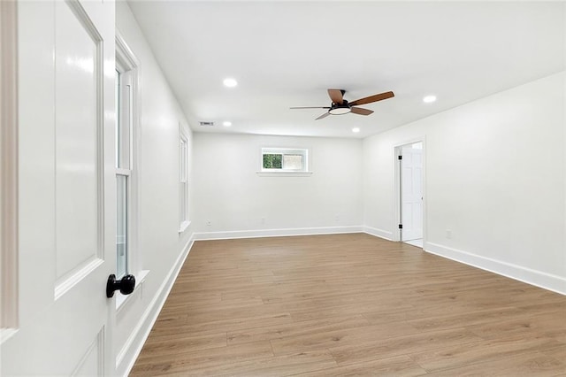 spare room with ceiling fan and light hardwood / wood-style flooring