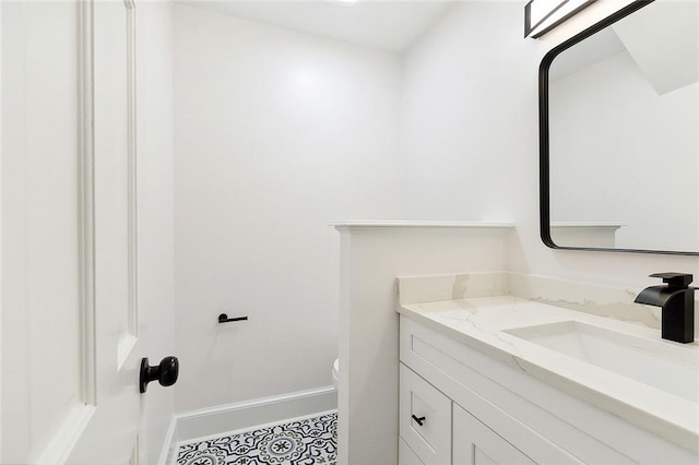 bathroom with vanity and toilet