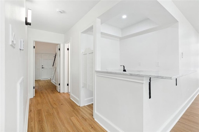 hall with light wood-type flooring