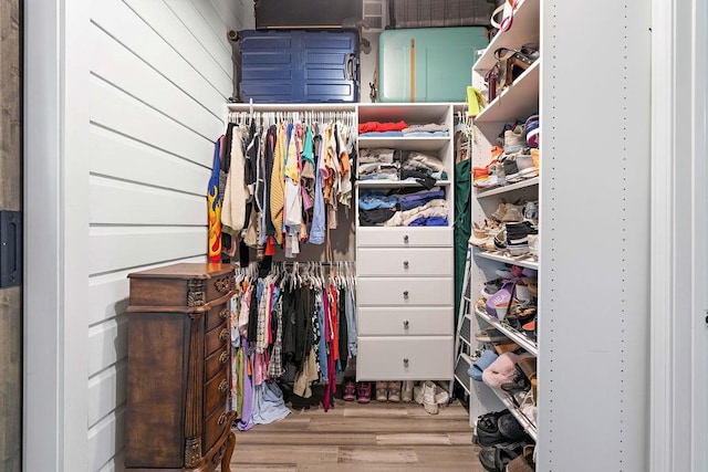 spacious closet featuring light wood-type flooring