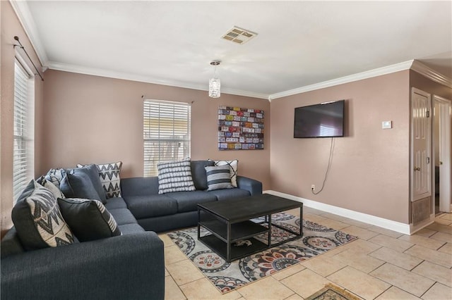 living room with ornamental molding and light tile patterned floors