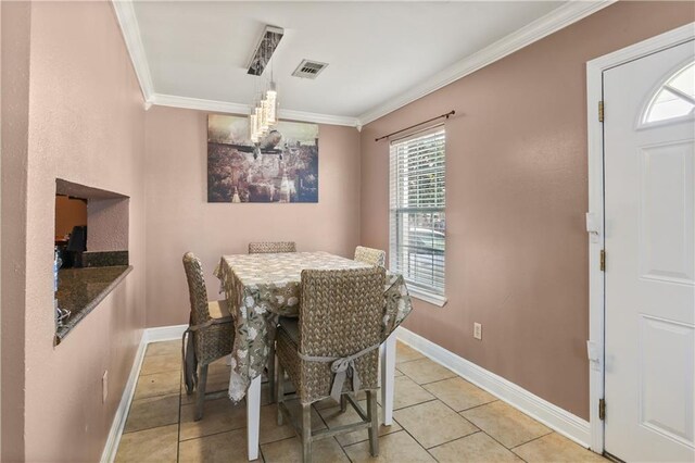 10210 Heritage Dr, New Orleans, LA 70127 - dining area featuring crown molding, a chandelier, baseboards, and light tile patterned floors