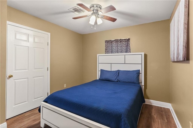 bedroom featuring ceiling fan and hardwood / wood-style flooring