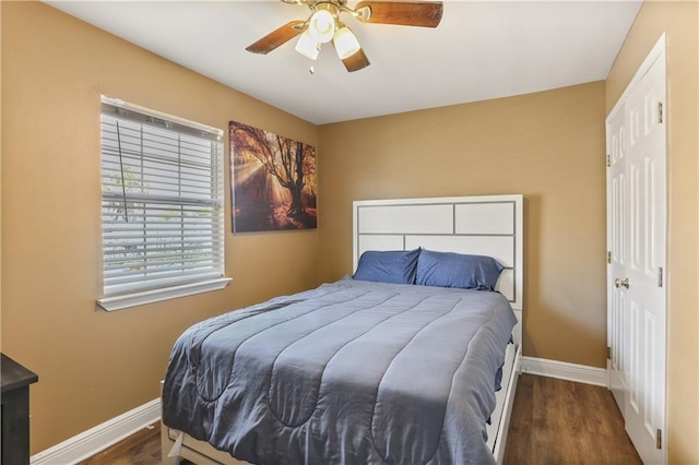 bedroom featuring ceiling fan and dark hardwood / wood-style floors