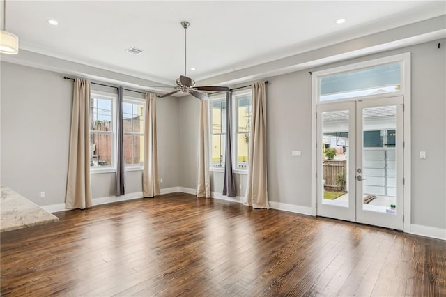 spare room with dark wood-type flooring, ceiling fan, and french doors