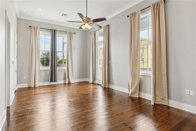 unfurnished room with ornamental molding, dark wood-type flooring, and ceiling fan