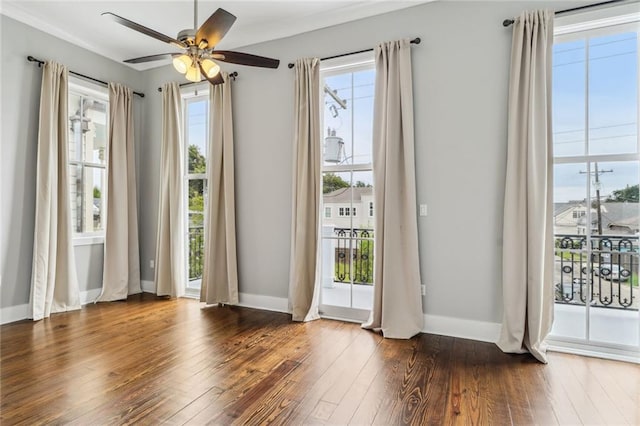 doorway to outside with ceiling fan and dark hardwood / wood-style floors