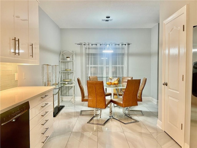 kitchen featuring wall chimney exhaust hood, sink, white cabinets, and stainless steel appliances