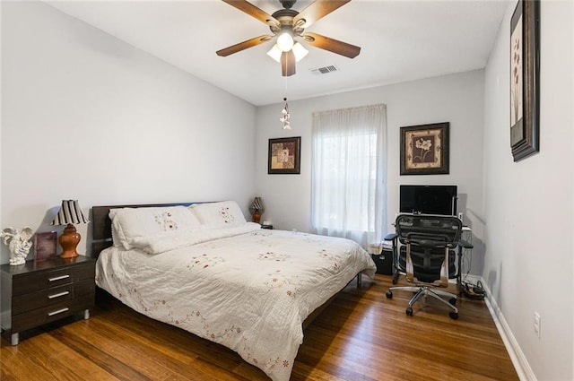 bedroom with hardwood / wood-style flooring and ceiling fan