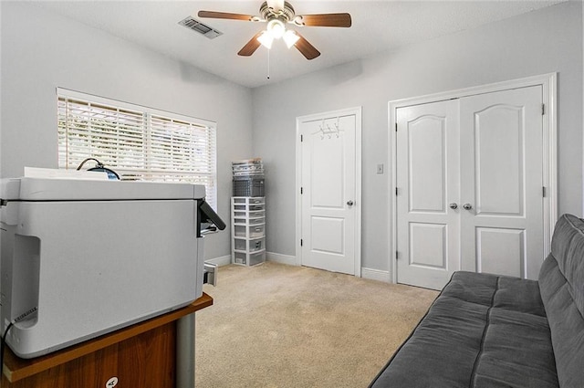 laundry area featuring cabinets, light tile patterned flooring, and washing machine and clothes dryer