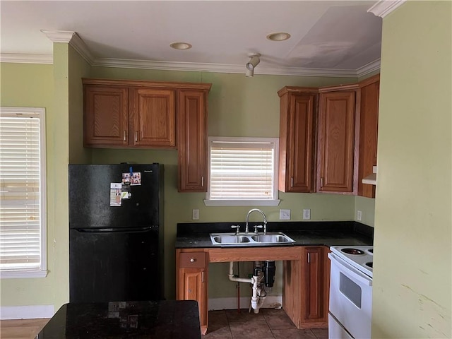 kitchen featuring sink, black refrigerator, ornamental molding, white electric stove, and tile patterned flooring