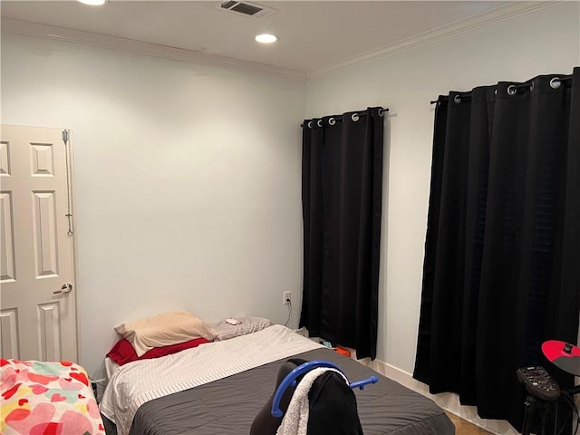 bedroom with crown molding