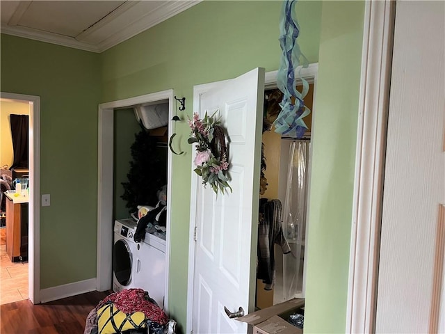 interior space with washer and clothes dryer, dark hardwood / wood-style floors, and crown molding