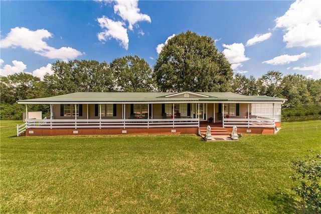 view of front of house featuring a front lawn and covered porch