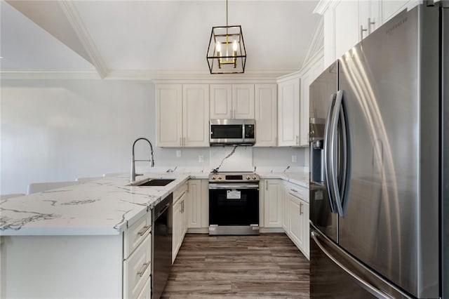 kitchen featuring hanging light fixtures, white cabinetry, kitchen peninsula, stainless steel appliances, and sink