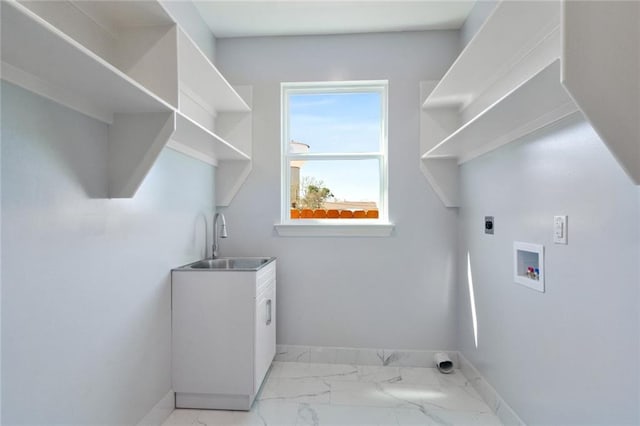 laundry room with hookup for an electric dryer, washer hookup, sink, and cabinets