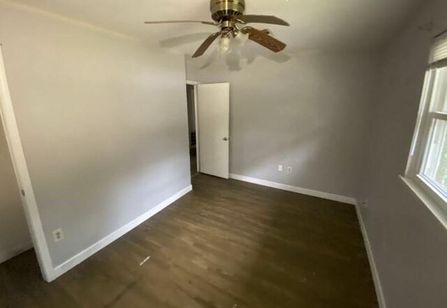 103 W Hickory St, Mandeville, LA 70471 - empty room featuring a ceiling fan, wood finished floors, and baseboards