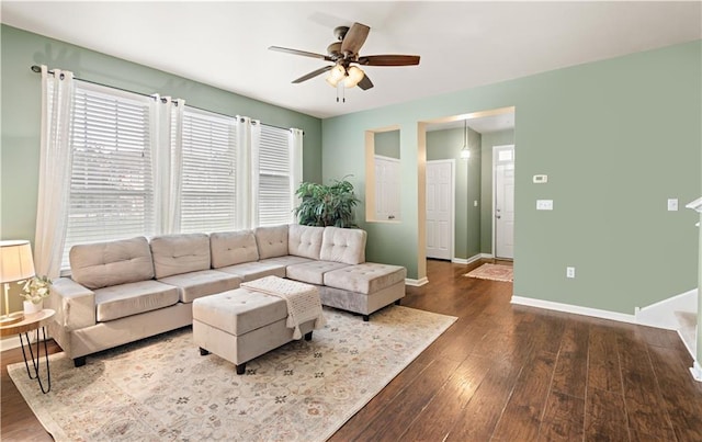 living room with ceiling fan and hardwood / wood-style flooring