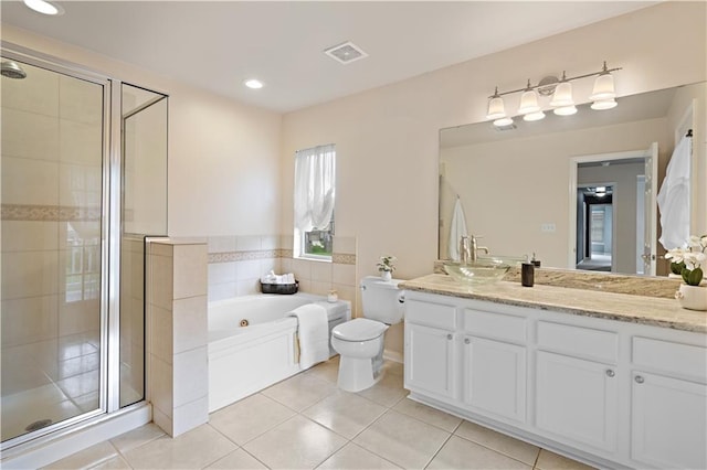 full bathroom with vanity, plus walk in shower, tile patterned flooring, and toilet