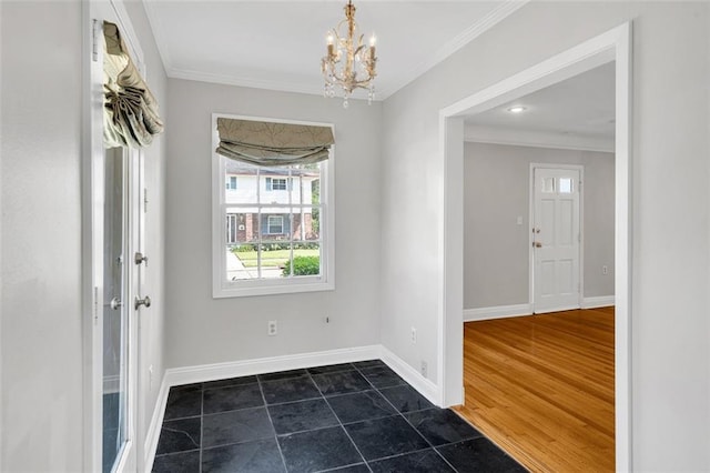 entrance foyer featuring an inviting chandelier, dark hardwood / wood-style floors, and ornamental molding