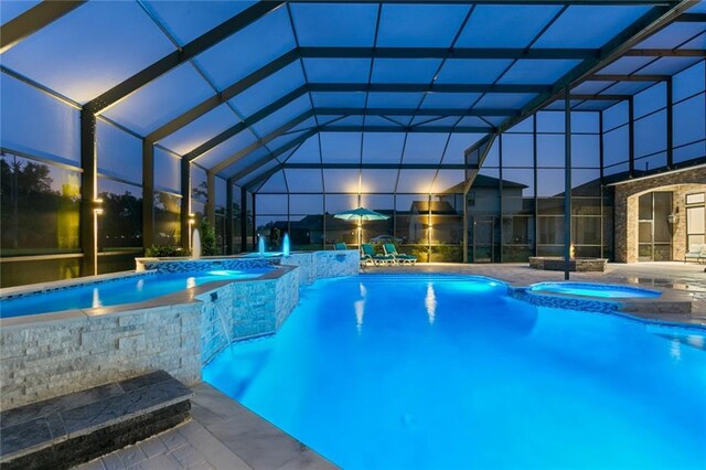 view of pool with an in ground hot tub and a patio area