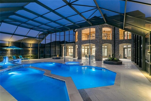 view of pool with a patio and an in ground hot tub