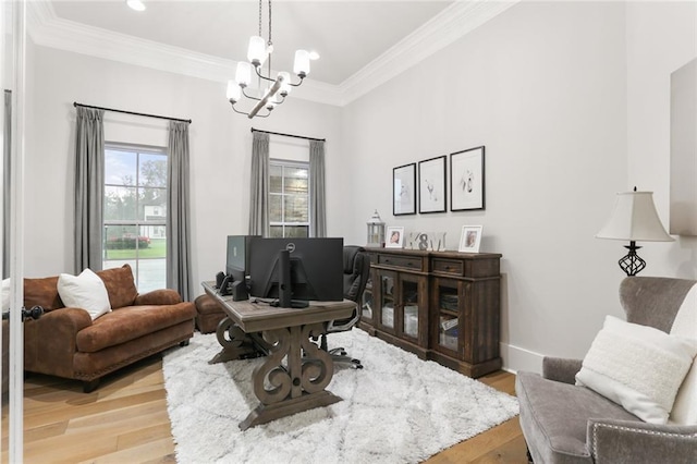 office area with light wood-type flooring, crown molding, and a chandelier