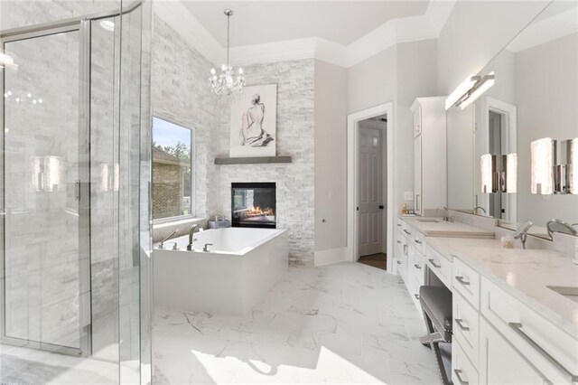 bathroom featuring ornamental molding, a stone fireplace, vanity, and plus walk in shower